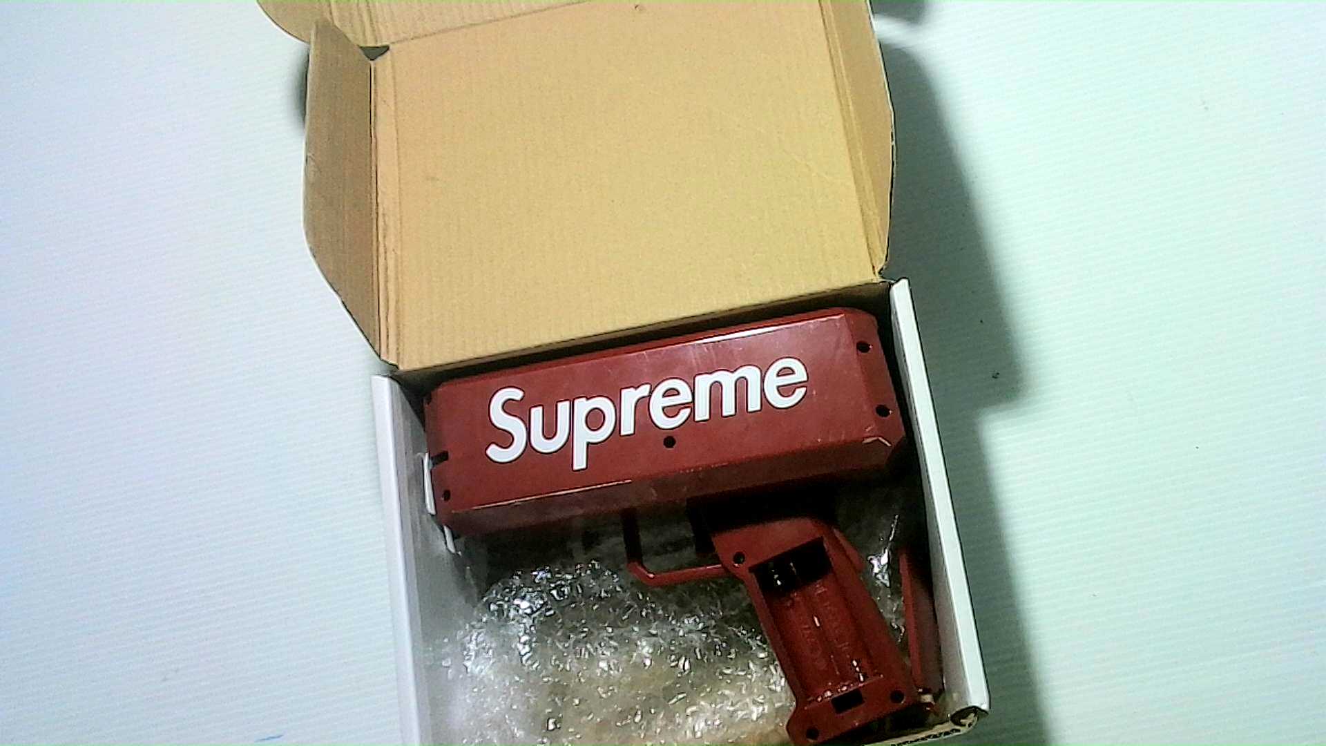 Supreme Money, plastic toy 