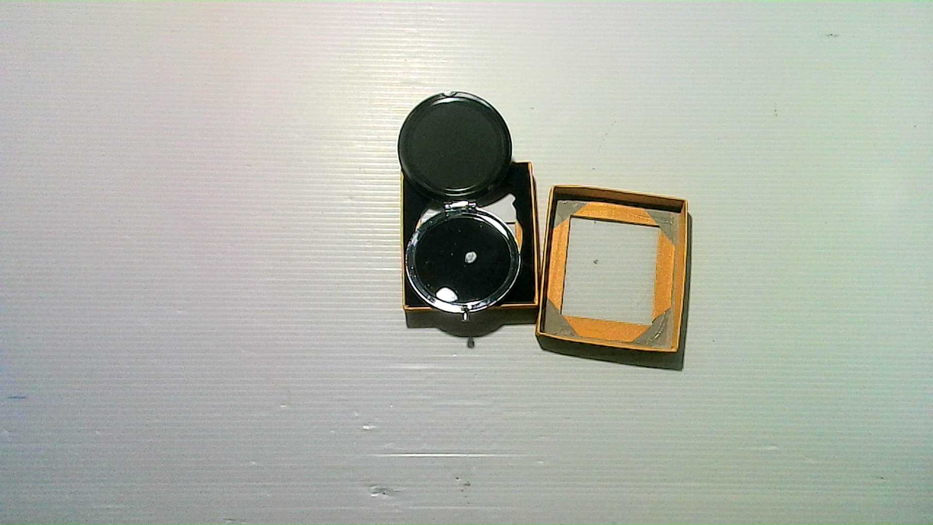 souvenir glass mirror in a box