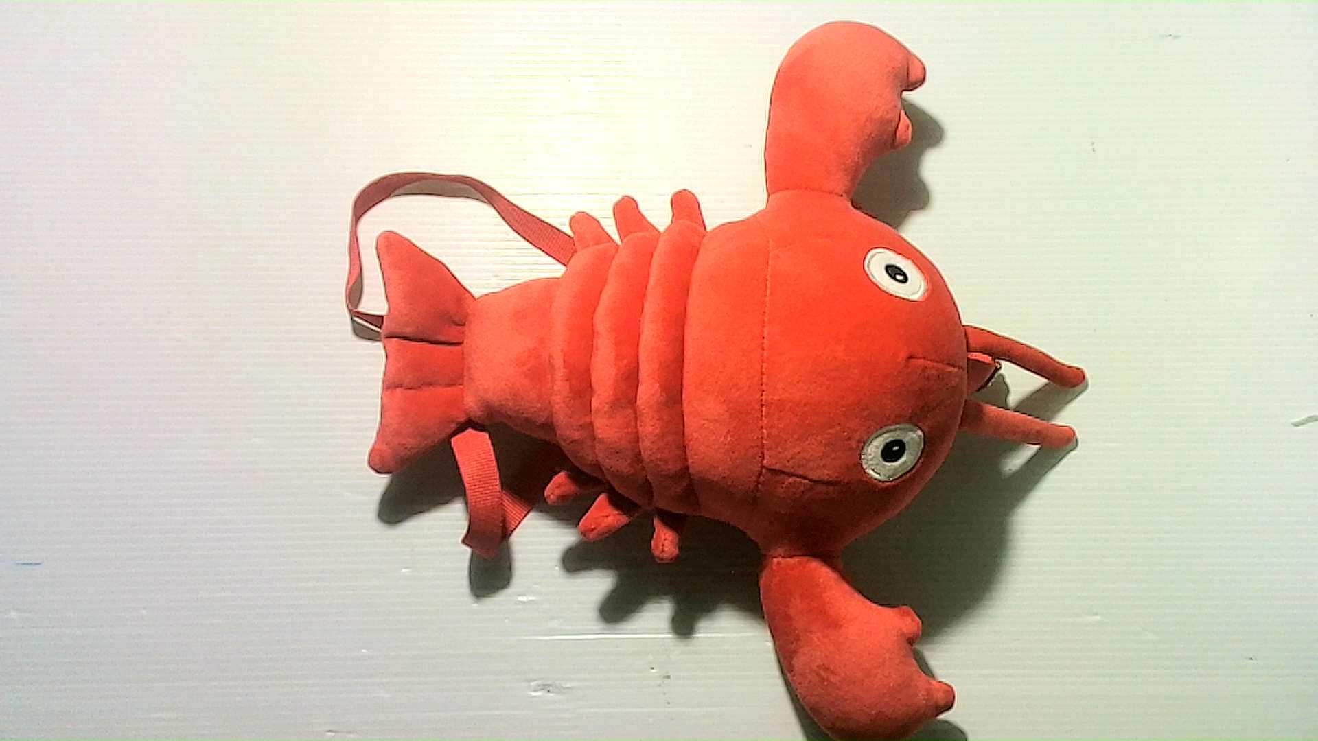 Bag with a plush crab toy